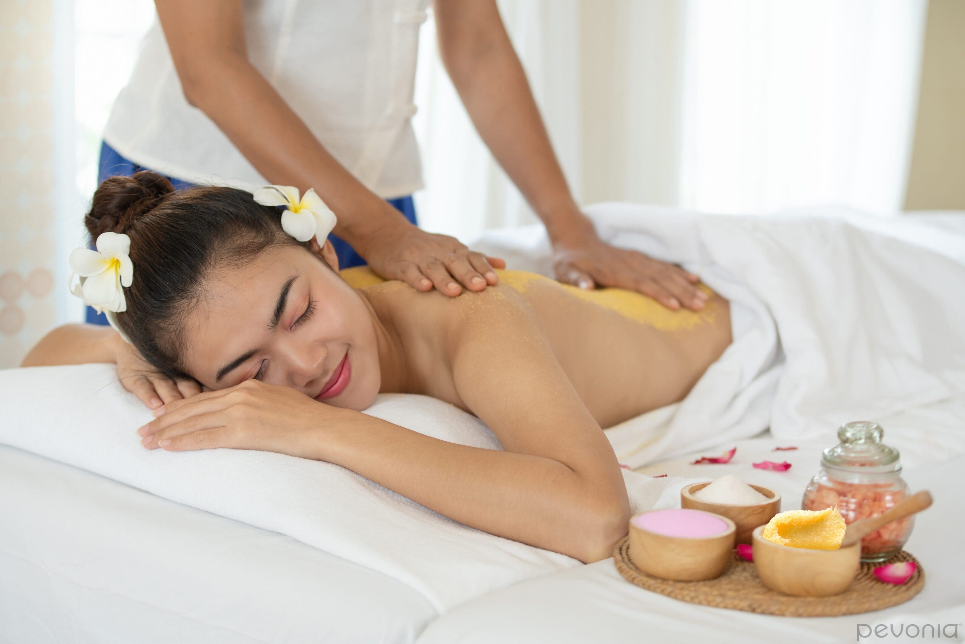 A woman getting a massage on her back